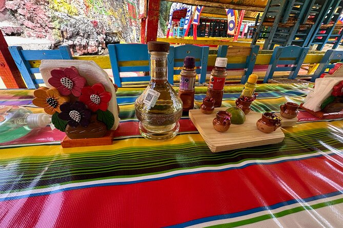 Boat Tour in Mexico City and Mezcal Fiesta with Food and ∞Drinks - Food and drinks: chilled bottles, two mezcal tastings, and party-friendly bites