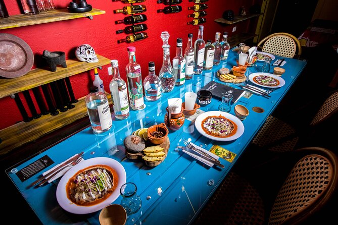 Mucho Gusto's Mezcal Tasting Experience - Oaxacan food at the table: tlayuda, enmolada, and tiacoyos with choice